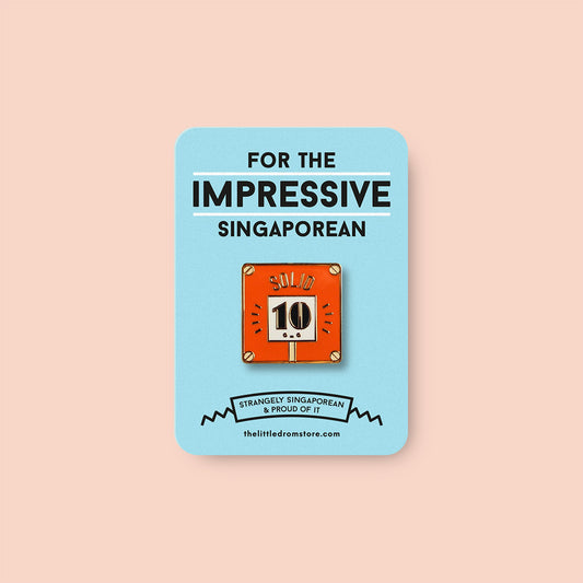 Strangely Singaporean Pin – Solid
